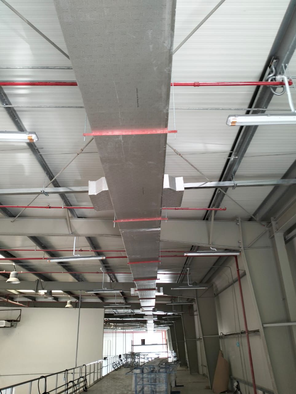 Industrial AC ductwork installation in a commercial warehouse in Dubai