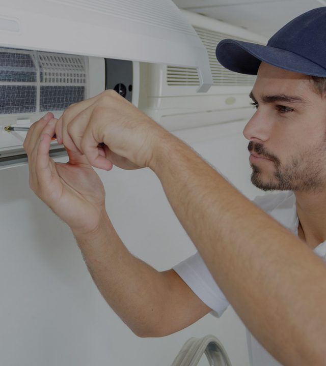 Expert technician repairing a residential split AC unit in Dubai